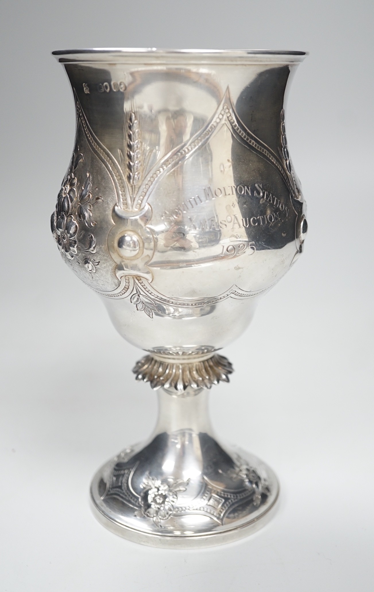 A Victorian silver presentation pedestal cup, embossed with a bull, with later engraved inscription, Edward & John Barnard, London, 1863, 21cm, 13.1 oz.